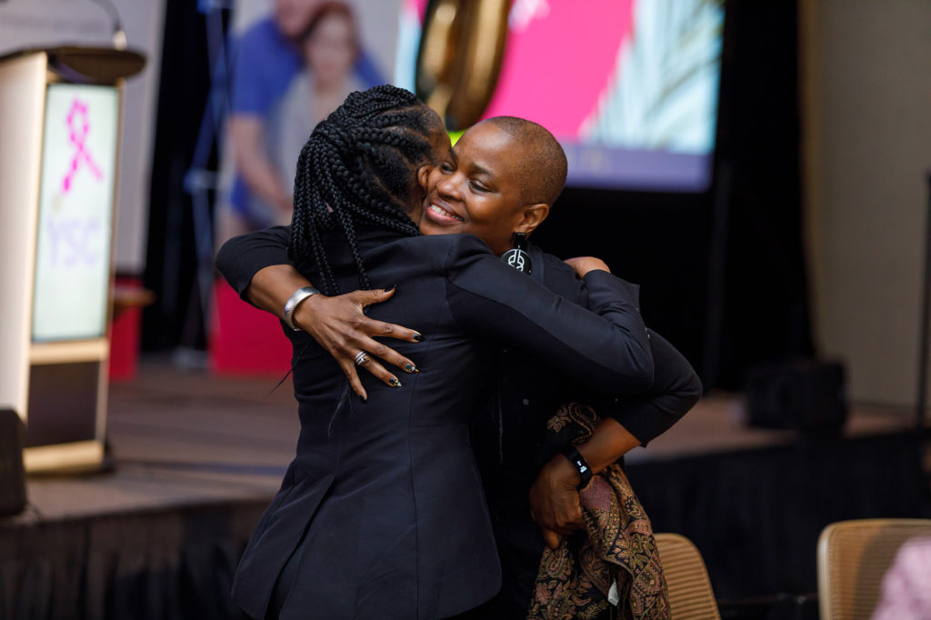 Emotional Hug After Final Speaker Wraps Conference - Dro Photography & Video Emotional Hug After Final Speaker Wraps Conference