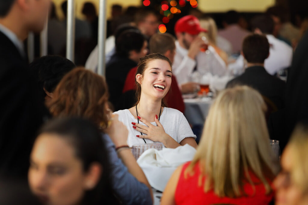 Attendee Laughing During Conference Luncheon - Dro Photography & Video Attendee Laughing During Conference Luncheon