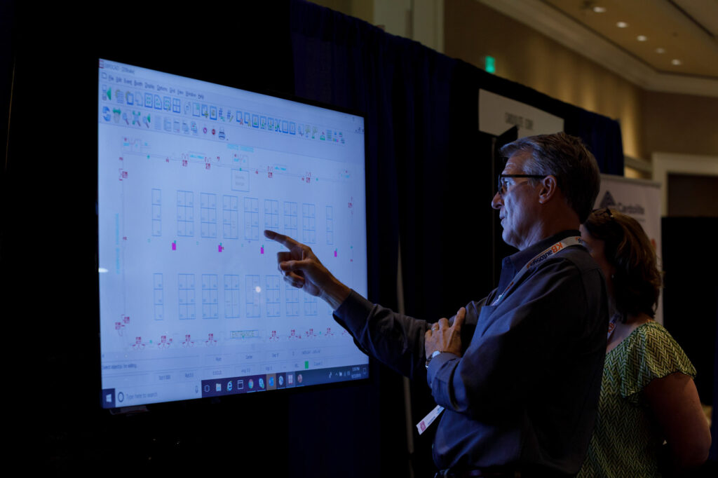 Attendees Viewing Seating Layouts - Dro Photography & Video Attendees Viewing Seating Layouts