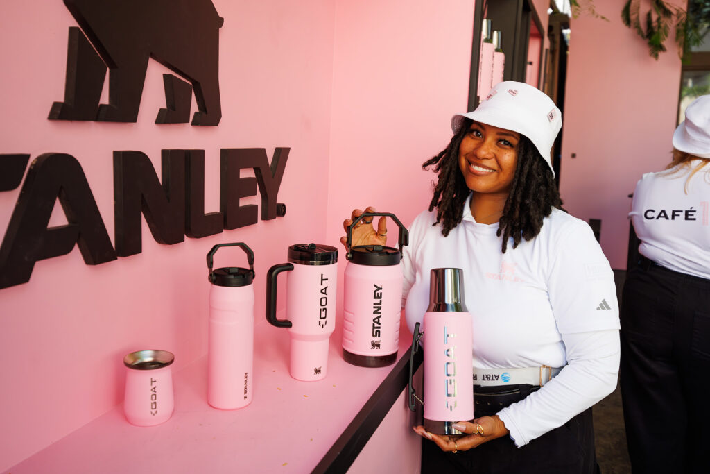 Produced by DroPhoto.com & OHelloMedia.com - Dro Photography & Video A model holds Stanley cups during a brand activation at Art Basel inside Panther Coffee in Wynwood, captured by Miami corporate event photographer Dro Photography & Video