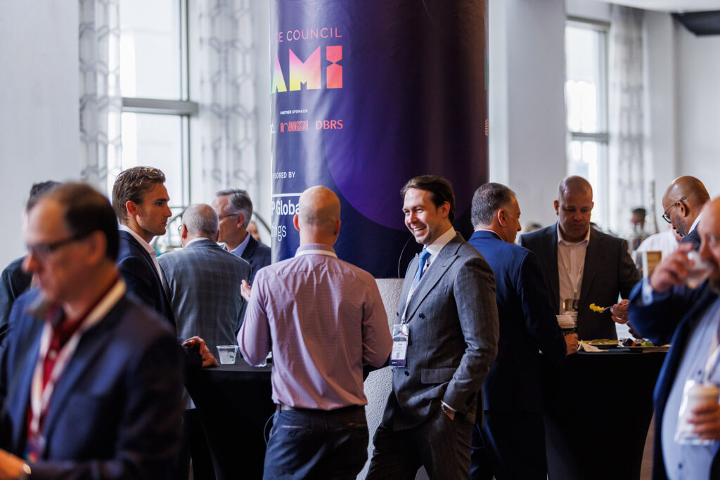 - Dro Photography & Video Corporate attendees networking during a conference break at the Loews Miami Beach Hotel, captured by a Miami event photographer.
