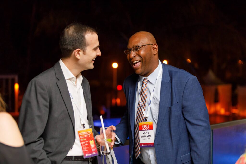 CREFC Networking Event at Loews Miami Beach - Dro Photography & Video Miami corporate event photographer capturing conference attendees laughing during networking event at Loews Hotel Miami Beach