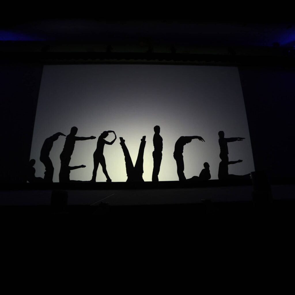 Performers form "Service" at a Fontainebleau Keynote - Dro Photography & Video Performers forming the word ‘Service’ during a corporate conference keynote at Fontainebleau Miami Beach
