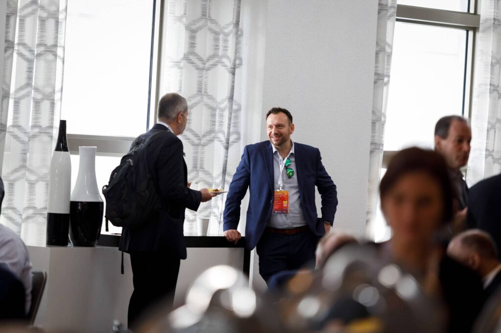 Conference Networking at Fontainebleau Miami Beach - Dro Photography & Video Corporate event photography of attendees networking during a conference break at Fontainebleau Miami Beach