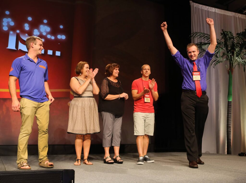Conference Award Winner at Fontainebleau - Dro Photography & Video Miami Corporate Event Photographer captures winner on stage during a Conference at the Fontainebleau Hotel Miami Beach