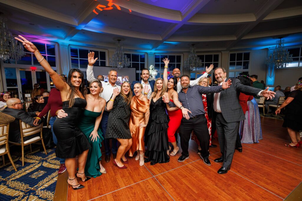 Leadership Team Holiday Party in Doral - Dro Photography & Video Miami corporate event photographer capturing leadership team group photo at annual holiday party at Trump National Hotel in Doral
