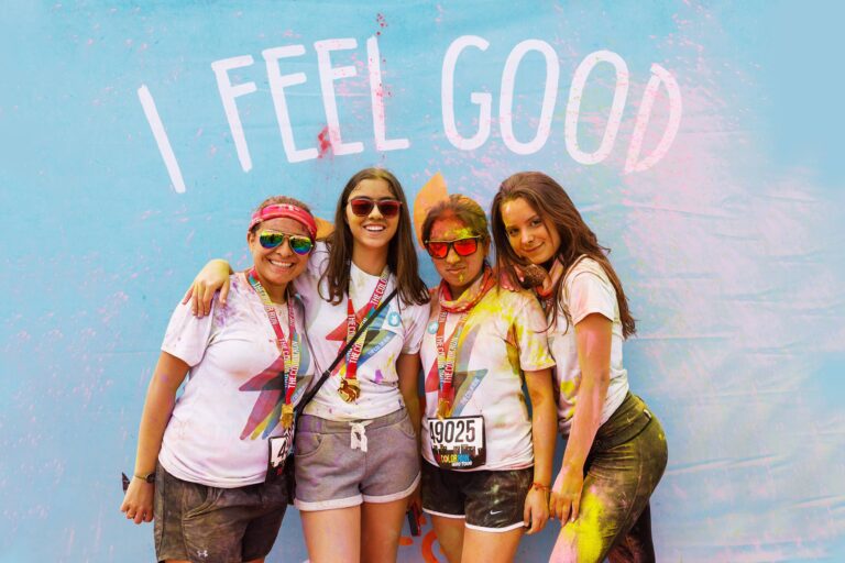 The Color Run at Disney Springs - Dro Photography & Video Orlando event photographer captures Runners celebrating after finishing The Color Run 5K at Disney Springs in Orlando