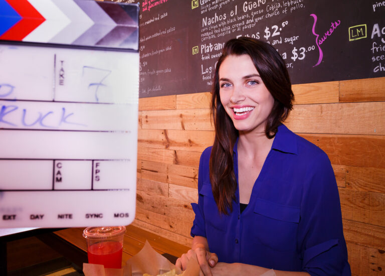 nyc-event-photographer-tv-host-sits-at-restaurant - Dro Photography & Video